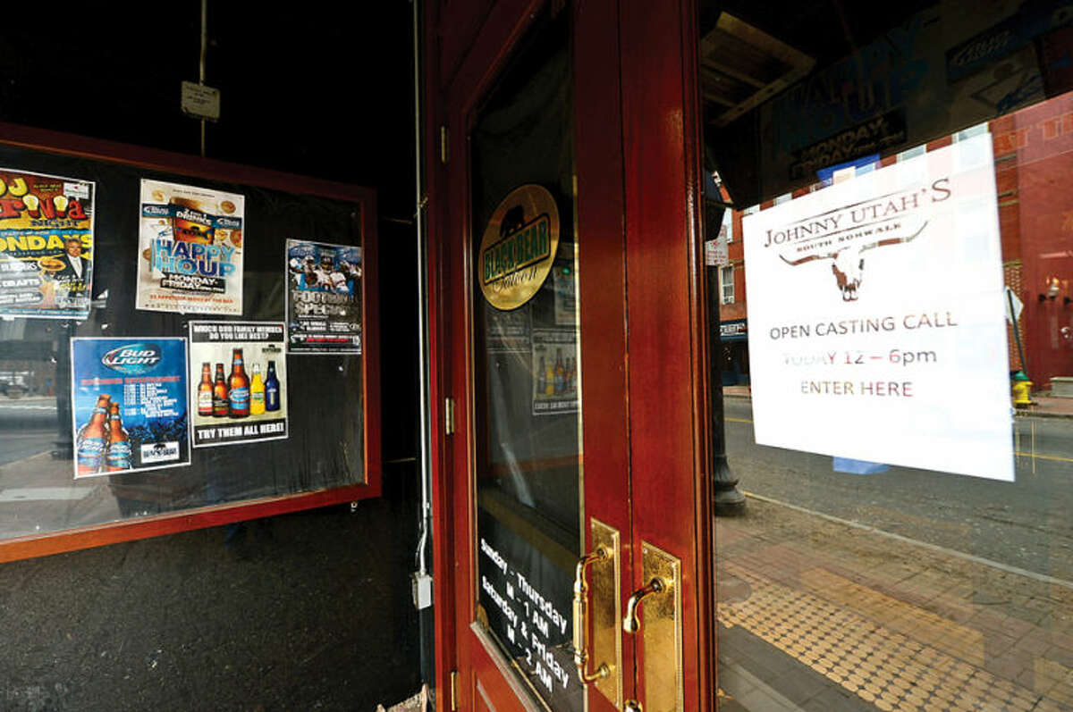Hour photo / Erik Trautmann The Black Bear Saloon at 80 Washington St. in South Norwalk is closed and will reemerge as Johnny Utah's, a country bar and grill. Some businesses are finding hard to keep their doors open while others look to reinvent themselves.