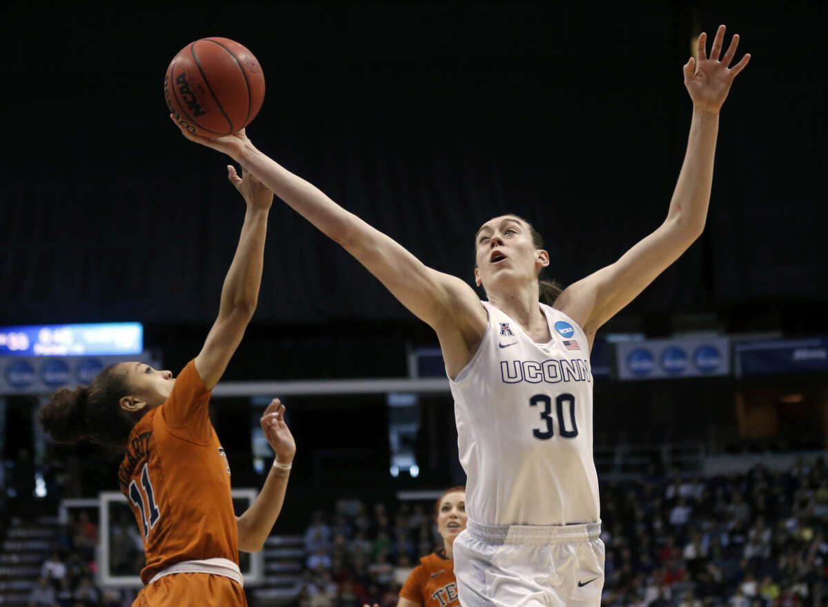 Connecticut forward Breanna Stewart (30) grabs a rebound over Texas guard Brooke McCarty during the first half of a women's college basketball regional semifinal game in the NCAA Tournament on Saturday, March 28, 2015, in Albany, N.Y. (AP Photo/Mike Groll)