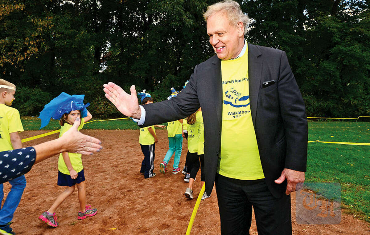 Hour photo / Erik Trautmann Norwalk Superintendent of School, Steven Adamowski and Rowayton Elementary School students and faculty participate in the PTA's fourth annual Walkathon Friday at the school.
