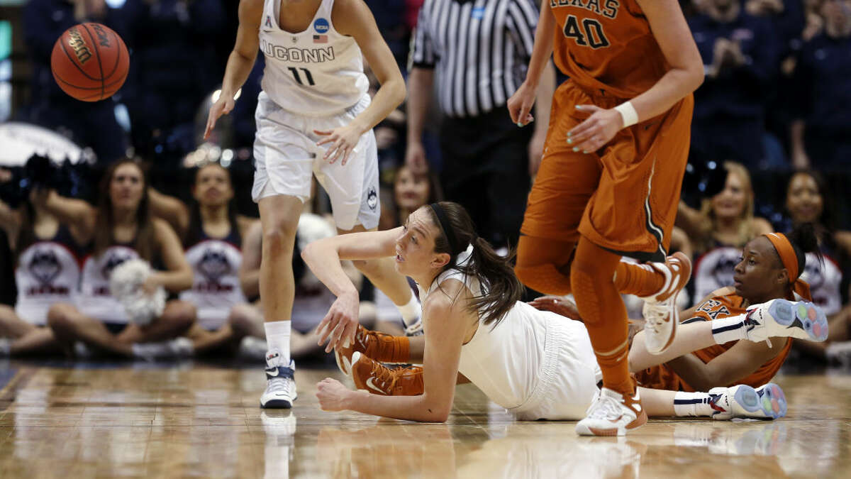 Connecticut forward Breanna Stewart, bottom center, passes to a teammate during the first half of a women's college basketball regional semifinal game against Texas in the NCAA Tournament on Saturday, March 28, 2015, in Albany, N.Y. (AP Photo/Mike Groll)