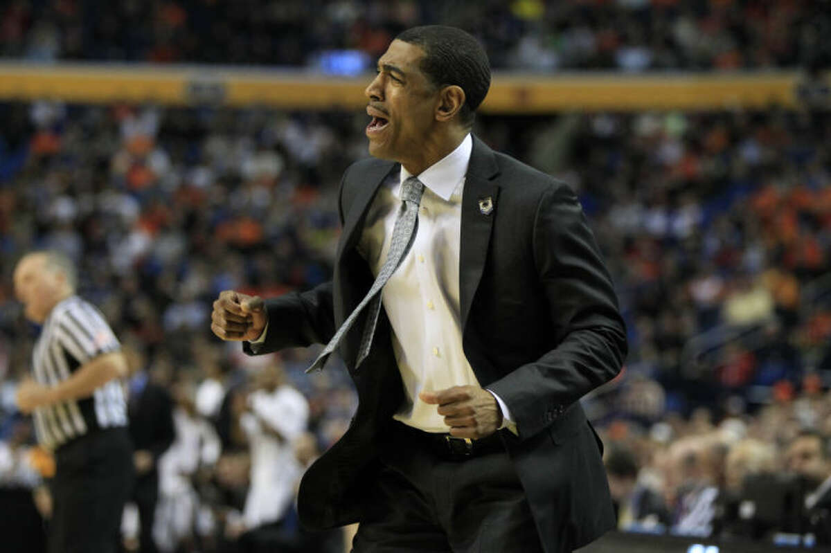 UConn coach Kevin Ollie reacts to a play during the first half of the third-round game in the men's NCAA college basketball tournament at the First Niagara Center, Saturday, March 22, 2014. (AP Photo/The Buffalo News, Harry Scull Jr)