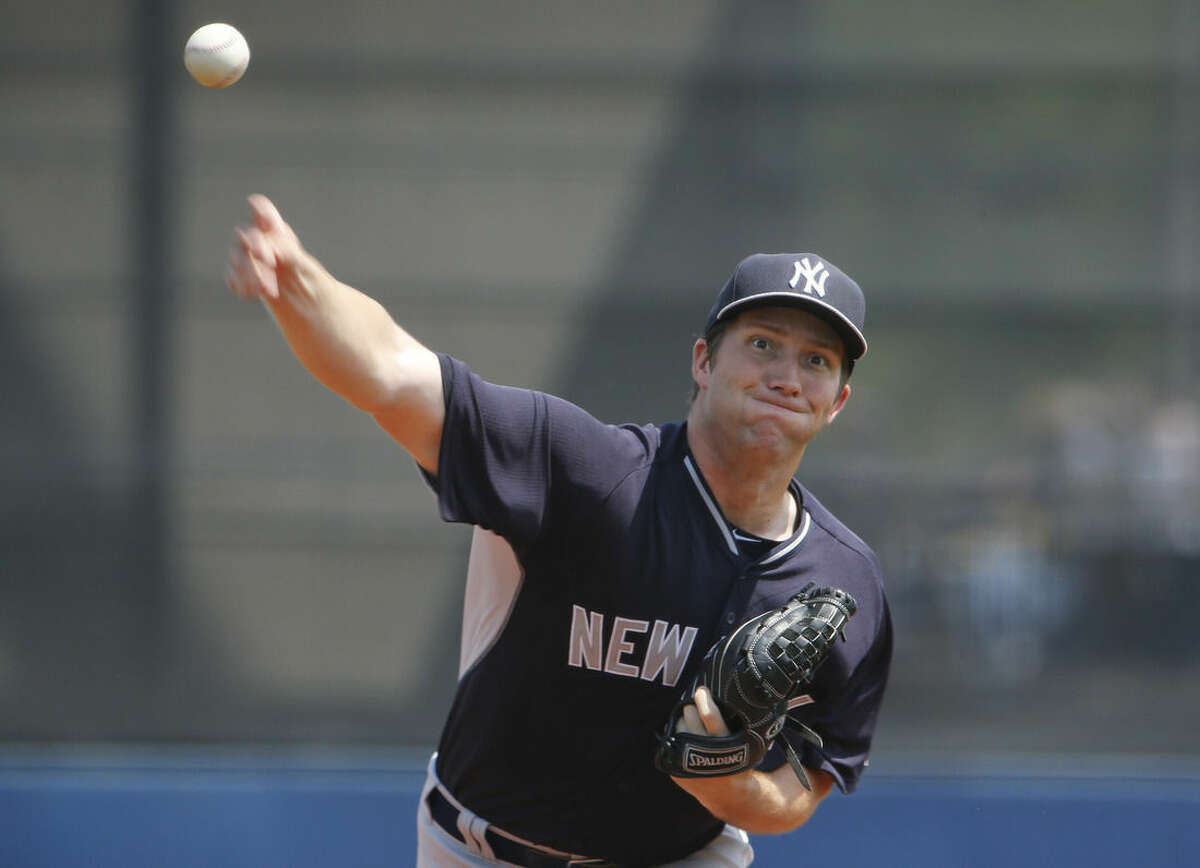 New York Yankees pitcher Adam Warren delivers against the Tampa Bay Rays during the first inning during an exhibition spring training baseball game, Thursday, March 26, 2015, in Port Charlotte, Fla. (AP Photo/Brynn Anderson)
