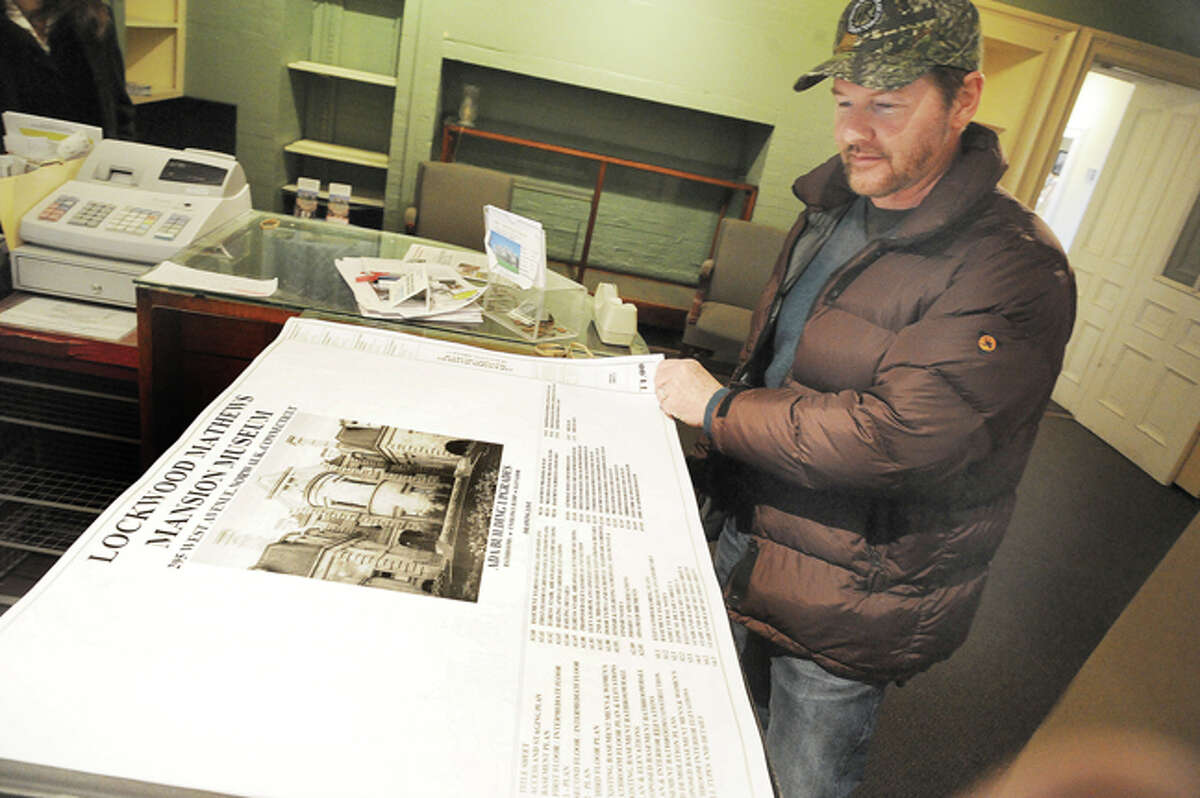 David Westmooreland, Chairman of the Norwalk Historical Commision with drawings of the proposed work for the Lockwood Mathews Mansion that will include an elevator and new bathroom facilities. Hour photo/Matthew Vinci