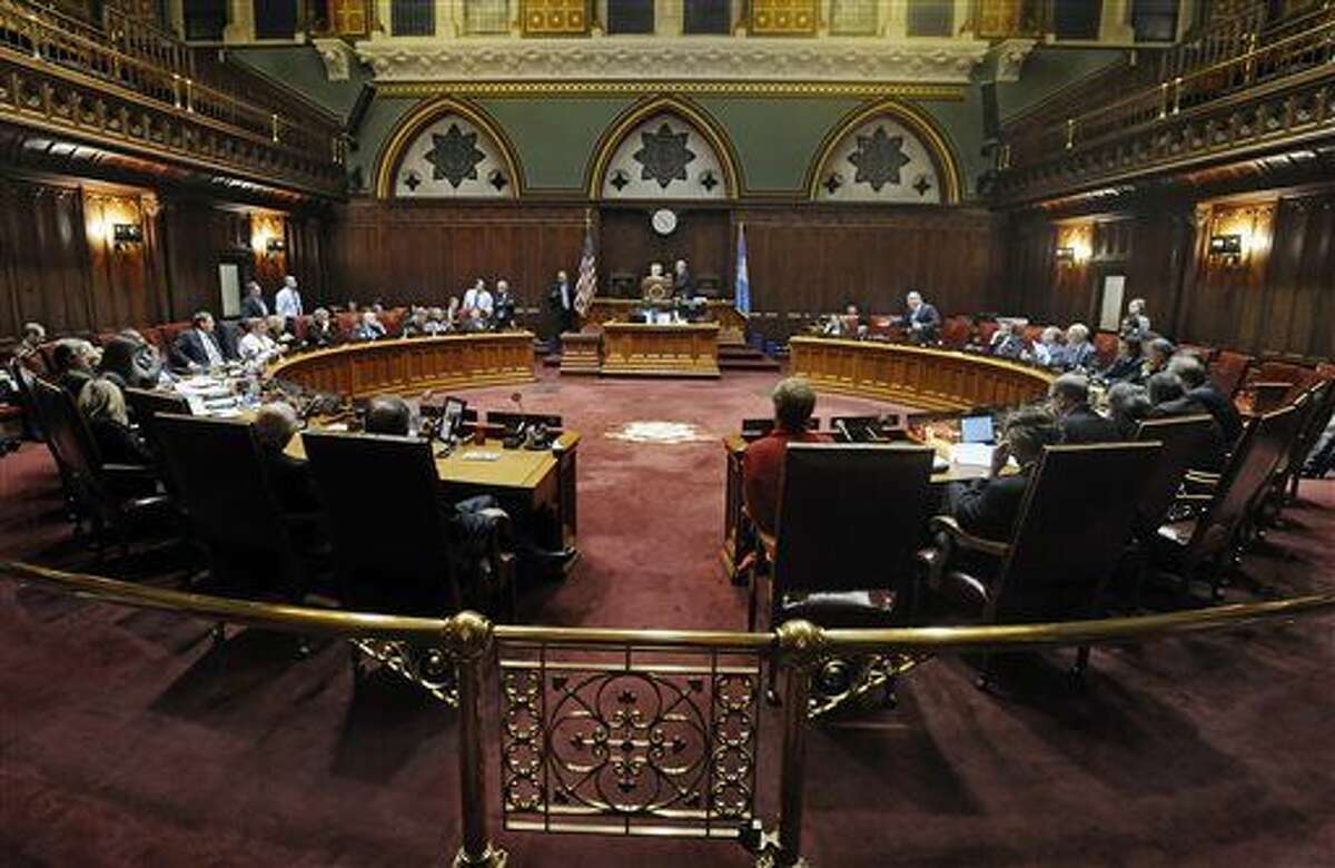 Connecticut state senators sit in a special session on a plan to close a projected $350 million budget deficit in the current fiscal year, at the state Capitol, Tuesday, Dec. 8, 2015, in Hartford, Conn. (AP Photo/Jessica Hill)