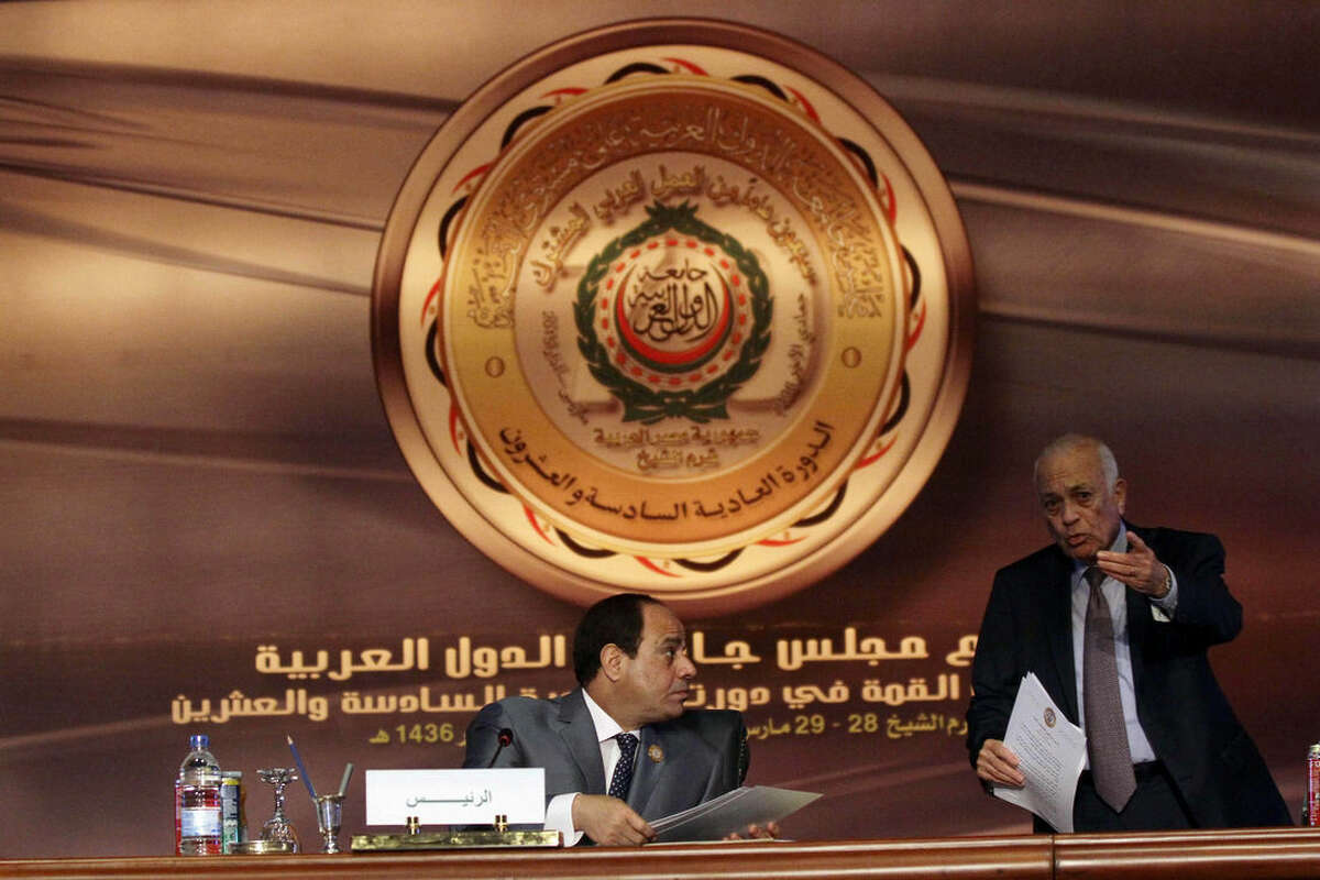 Egyptian President Abdel-Fattah el-Sissi, left, chairs a meeting of Arab foreign ministers as Arab League Secretary-General Nabil Elaraby makes a point, in Sharm el-Sheikh, South Sinai, Egypt, Sunday, March 29, 2015. Arab League member states at a summit in this Red Sea resort have agreed to form a joint inter-Arab military peacekeeping force. (AP Photo/Ahmed Abdel Fatah, El Shorouk Newspaper)