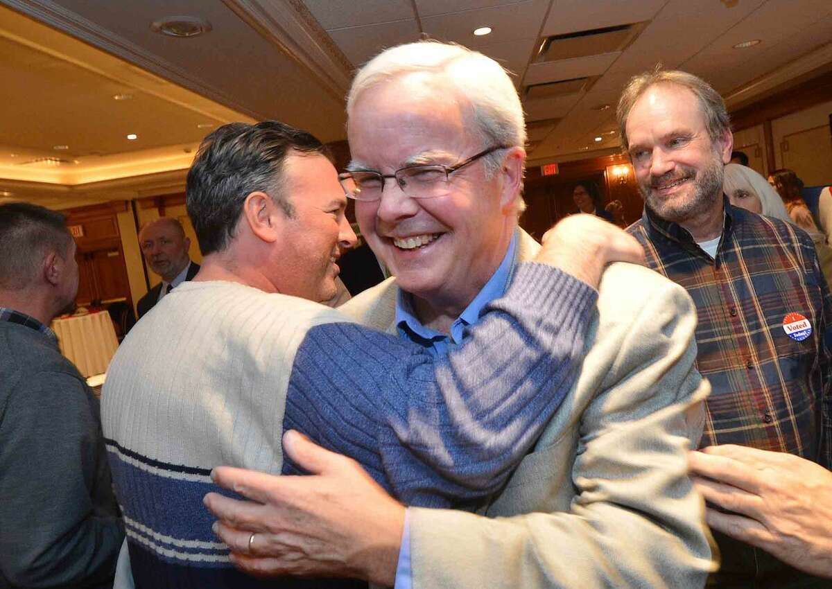 Hour Photo/Alex von Kleydorff Mike Lyons gets a congratulations from Bryan Meek during Republican Party Election night