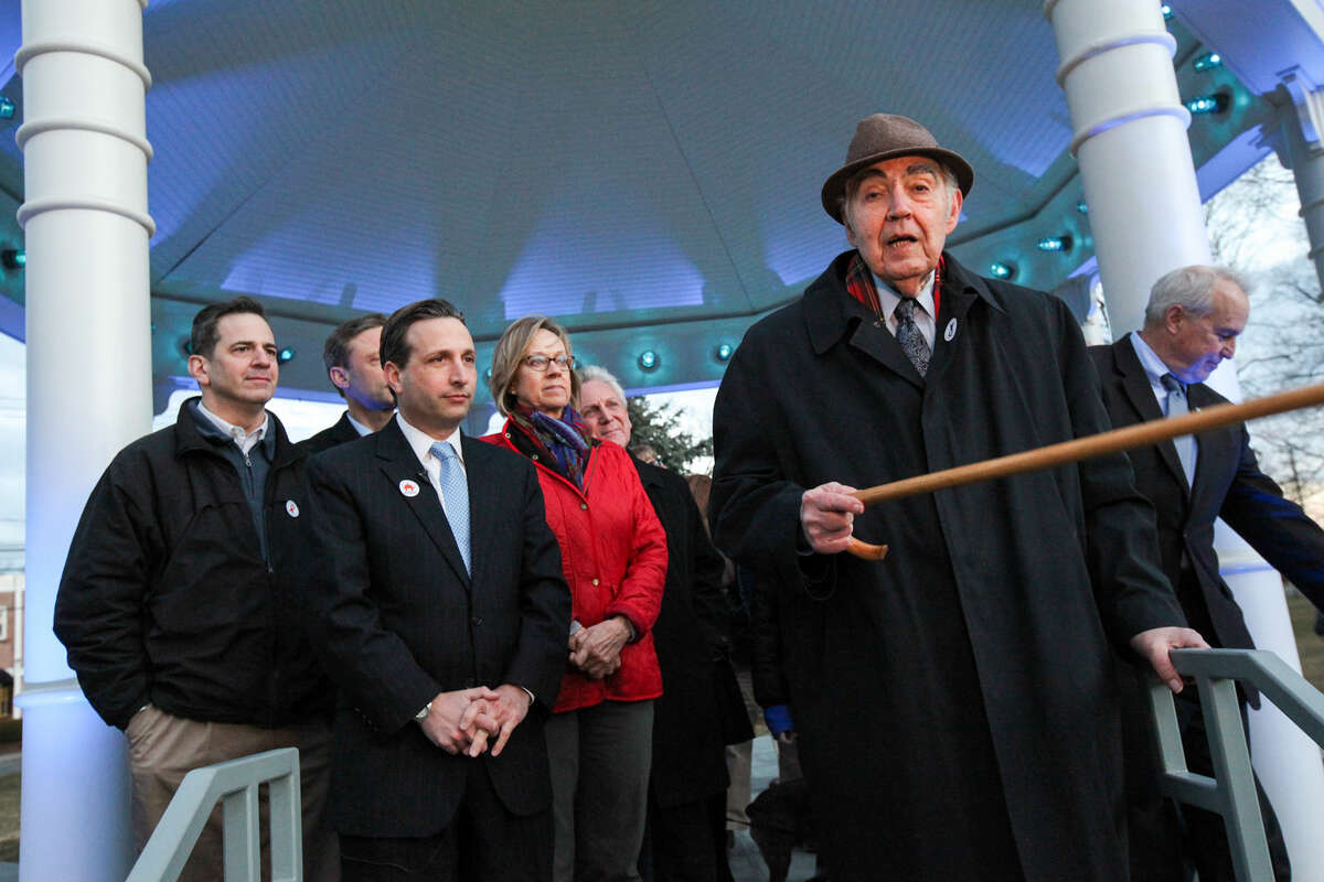 Hour photo/Chris Palermo. Former Norwalk Mayor Frank Zullo speaks among other Norwalk dignitaries in recognition of April as Autism Aqarenes Month at the Norwalk Green Gazebo Monday night. The gazebo will remain blue for the entire month of April.