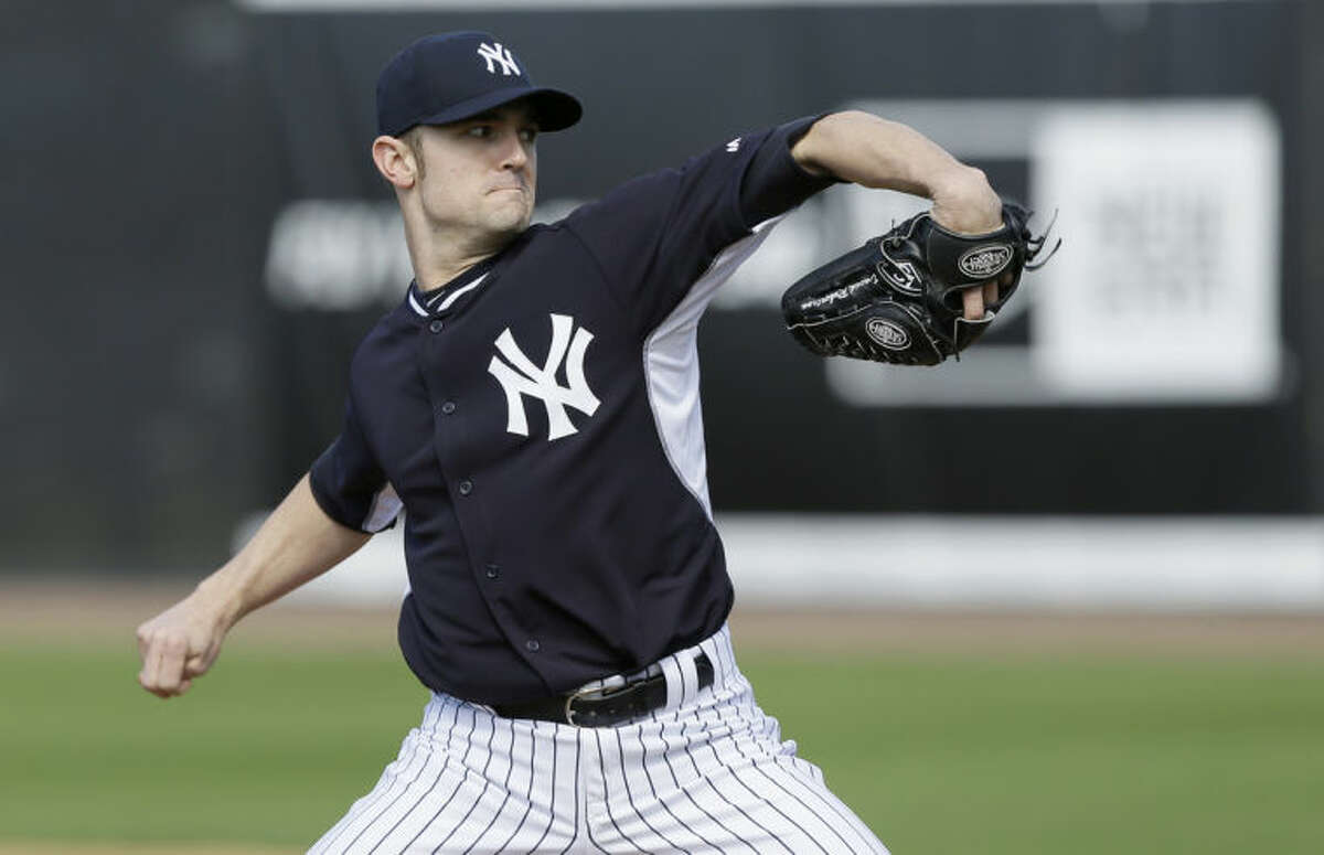 FILE - In this Feb. 15, 2014 file photo, New York Yankees relief pitcher David Robertson participates in a drill during spring training baseball practice in Tampa, Fla. With Mariano Rivera relaxing in retirement, David Robertson takes over for the greatest closer in baseball history. (AP Photo/Charlie Neibergall, File)