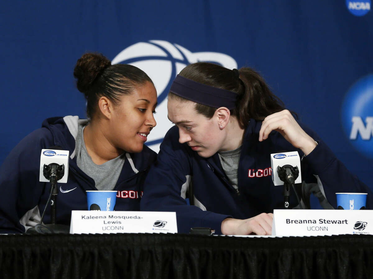 Connecticut players Kaleena Mosqueda-Lewis, left, and Breanna Stewart talk during a news conference for a women's college basketball regional final game in the NCAA Tournament on Sunday, March 29, 2015, in Albany, N.Y. UConn plays Dayton on Monday. (AP Photo/Mike Groll)