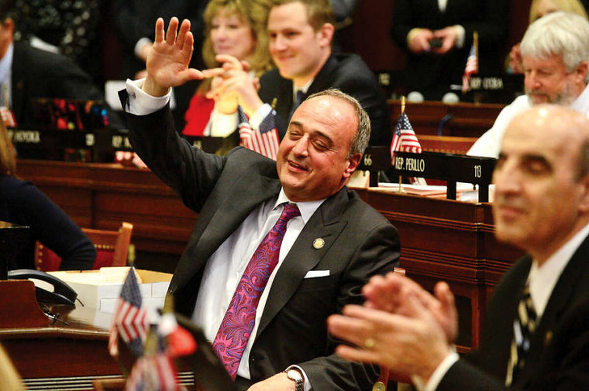 Hour photo / Erik Trautmann Colleagues in the Connecticut Legislature bid farewell to Minority Leader Larry Cafero (R-142) as he announces that he would not seek reelection Wednesday at the Capitol.