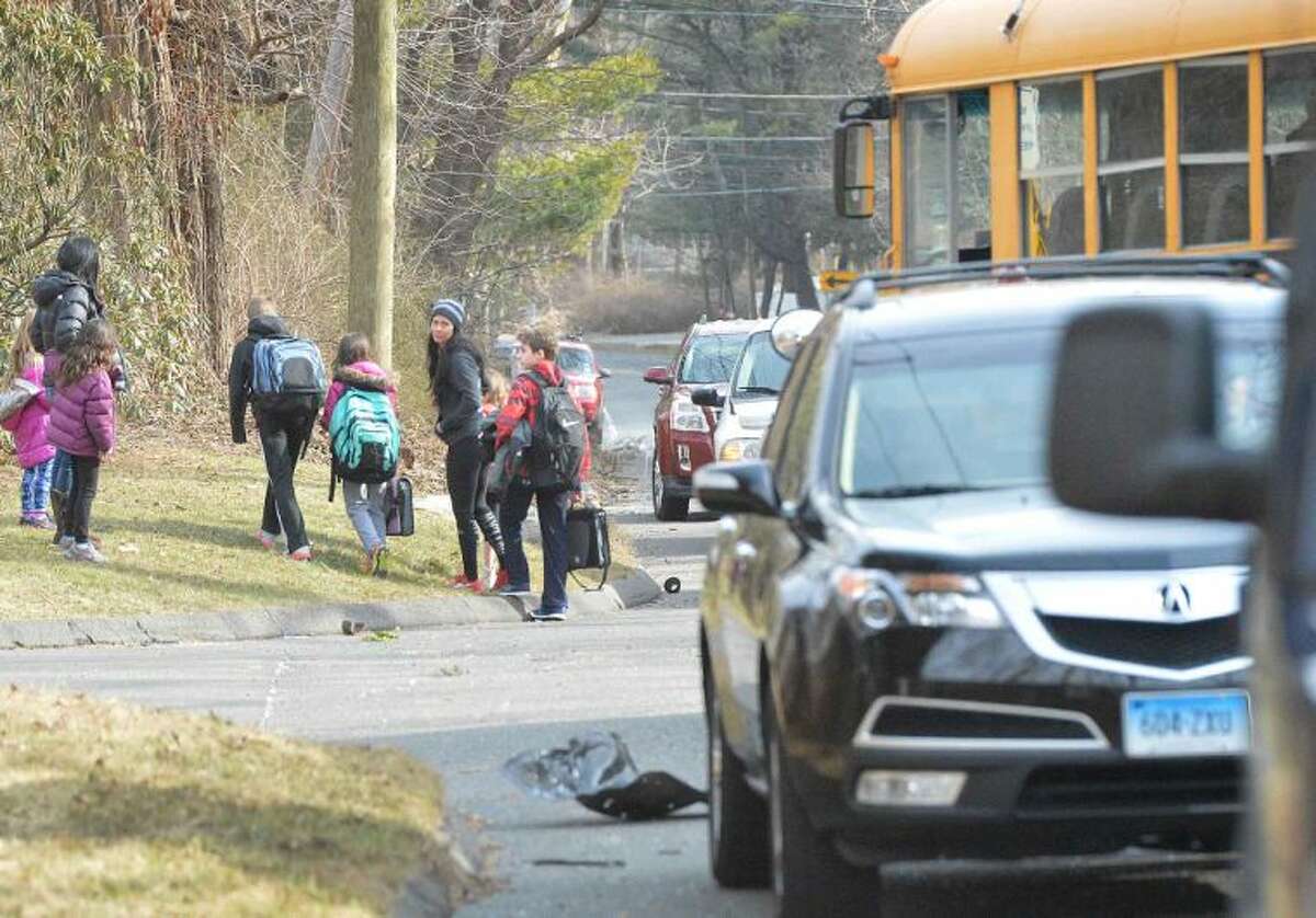Hour Photo/Alex von Kleydorff Acccident scene involving multiple vehicles and a Norwalk Public School bus on the Wilton Westport line, Thursday at 3:30