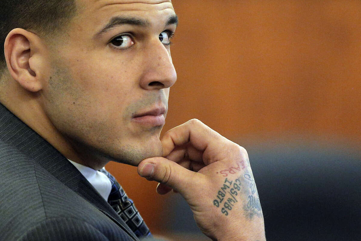 FILE - In this April 1, 2015 file photo, former New England Patriots NFL football player Aaron Hernandez listens as prosecution witness Alexander Bradley testifies during his murder trial, at Bristol County Superior Court in Fall River, Mass. Hernandez is accused of killing Odin Lloyd in June 2013. (AP Photo/Brian Snyder, Pool, File)