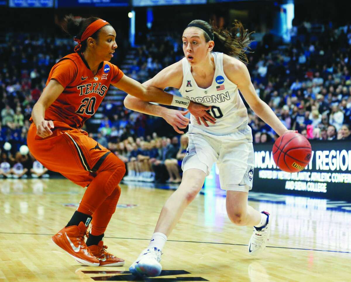 FILE - In this March 28, 2015 file photo, Connecticut forward Breanna Stewart (30) drives against Texas guard Brianna Taylor (20) during the first half of a women's college basketball regional semifinal game in the NCAA Tournament in Albany, N.Y. (AP Photo/Mike Groll, File)