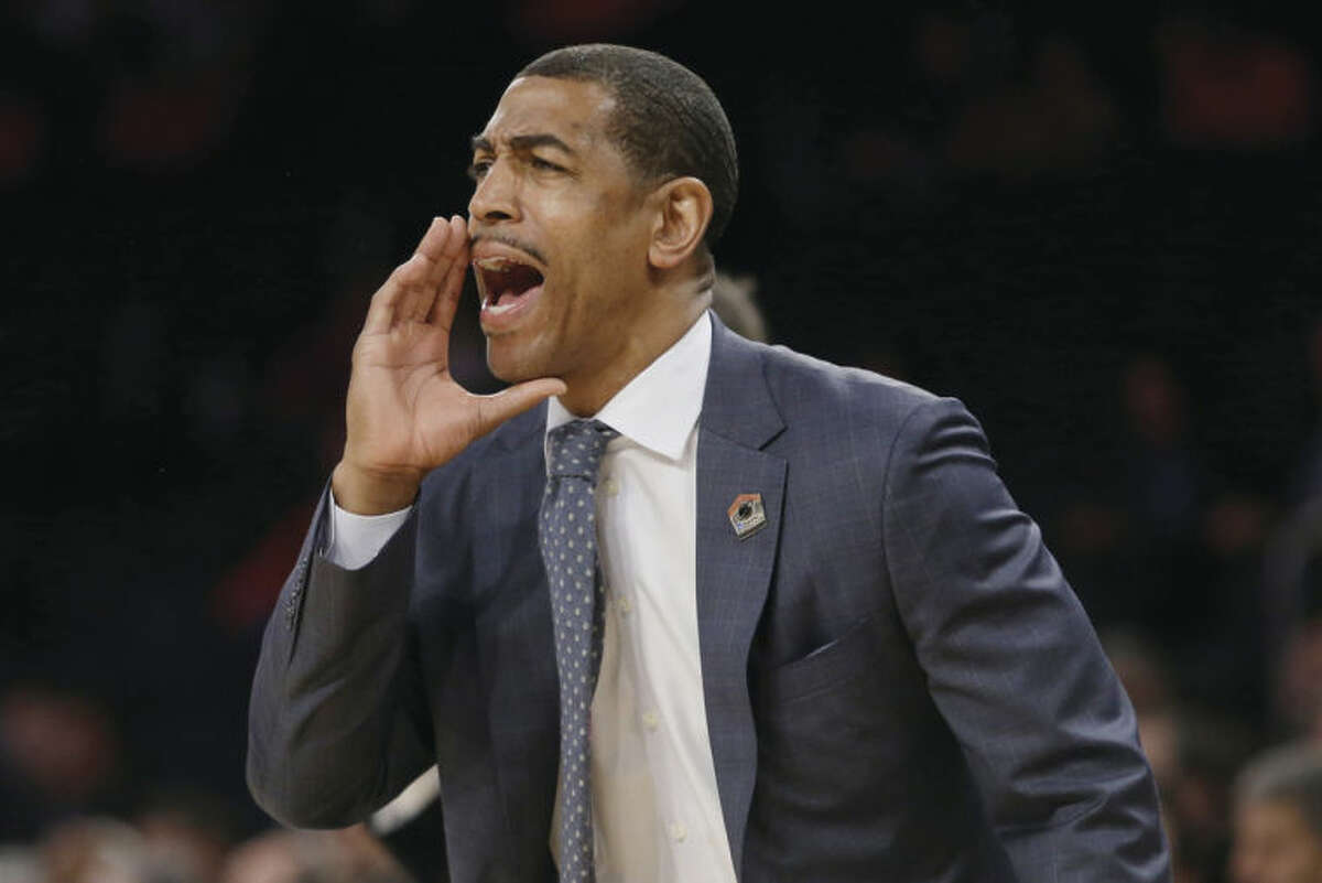 AP photo Connecticut head coach Kevin Ollie calls out to his team during the first half of Friday's East Regional semifinal against Iowa State in New York. Ollie has the Huskies within one win of the Final Four.