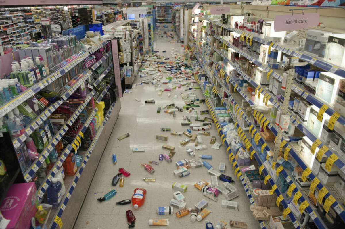 Merchandise is strewn across the floor in a La Habra Walgreens following a 5.1 earthquake centered near La Habra Friday night March 28, 2014. (AP Photo/The Orange County Register, Blaine, Ohigashi)