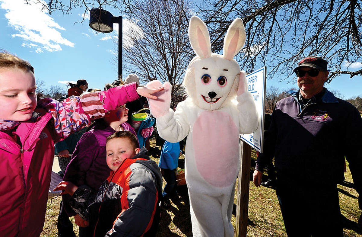 Hour photo / Erik Trautmann Nearly two hundred children take part in the 64th annual Greens Farms Volunteer Fire Company Easter Egg Hunt at Long Lots School School Saturday