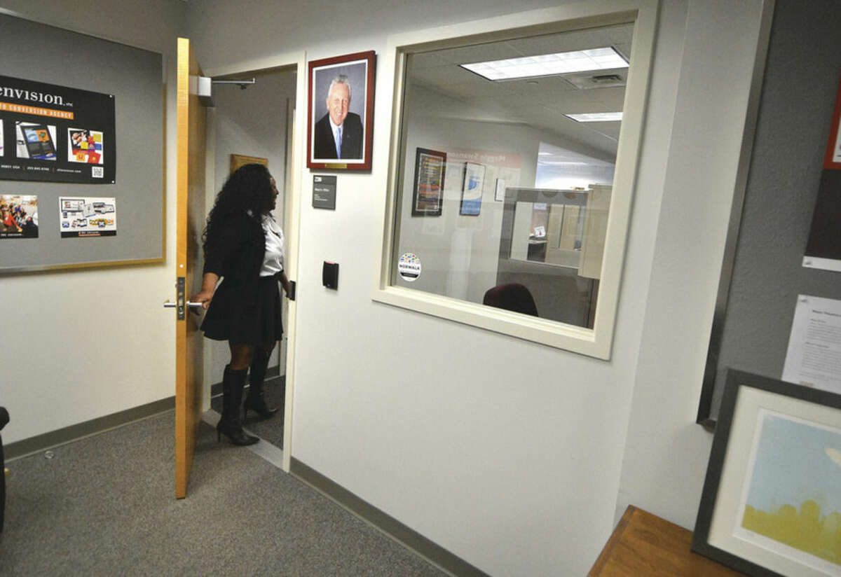 Hour Photo/Alex von Kleydorff Sally Johnson, The Mayors Executive Assistant enters the Mayors office where security upgrades will include controlled access trough the door and a security window as well.