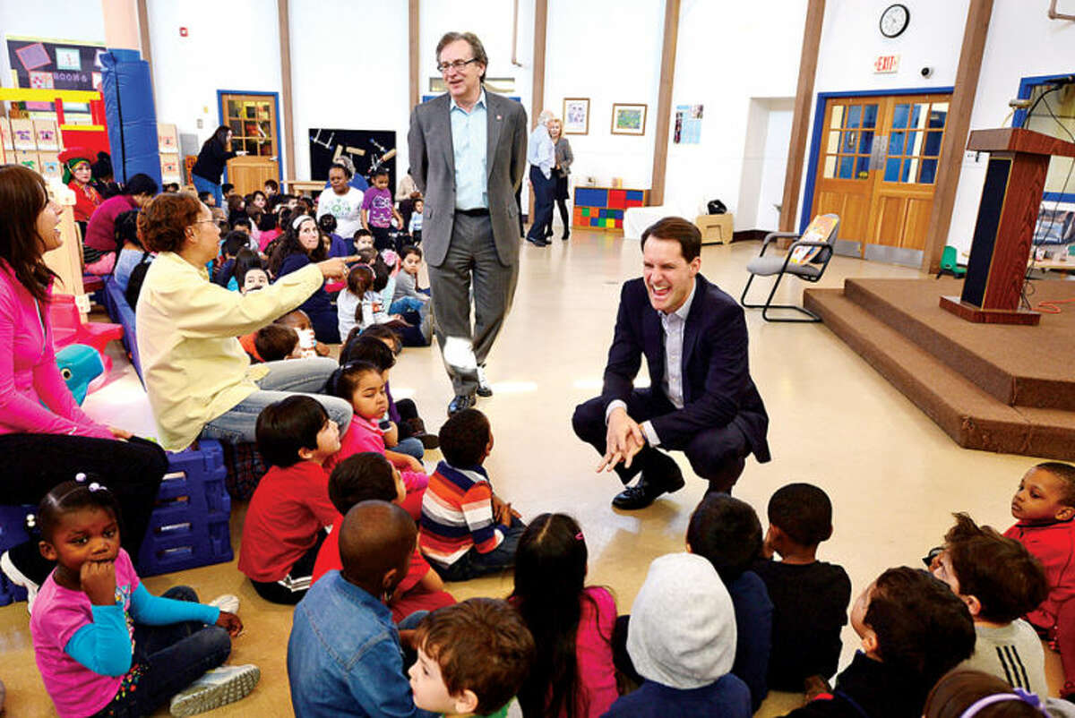 Hour photo / Erik Trautmann US Congressman Jim Himes (D-4) visits Childcare Learning Centers in Stamford Tuesday morning to read stories to the children there in recogniton of the upcoming Week of the Young Child (April 6-12). Week of the Child is an annual celebration focusing public attention on the needs of young children and their families. Childcare Learning Centers has provided childcare and early childhood education and development programs for Stamford’s working families for over 100 years.
