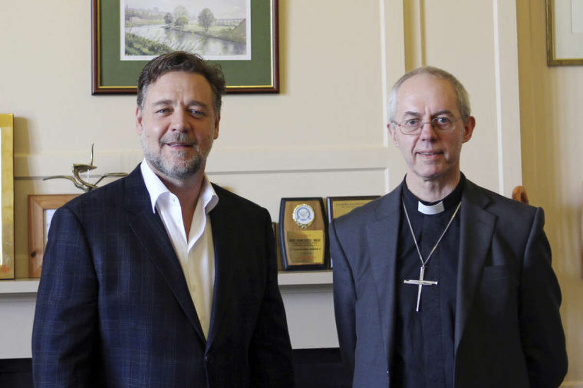 Photo issued by Lambeth Palace, showing the Archbishop of Canterbury Justin Welby as he meets with New Zealand actor Russell Crowe to discuss faith and spirituality at Lambeth Palace in London Tuesday April 1, 2014. Even though Crowe's new film has prompted anger and cries of blasphemy from some religious groups, Welby held a short private meeting with Crowe, who is in London to promote his new movie based on the biblical story of Noah. (AP Photo / Lambeth Palace)