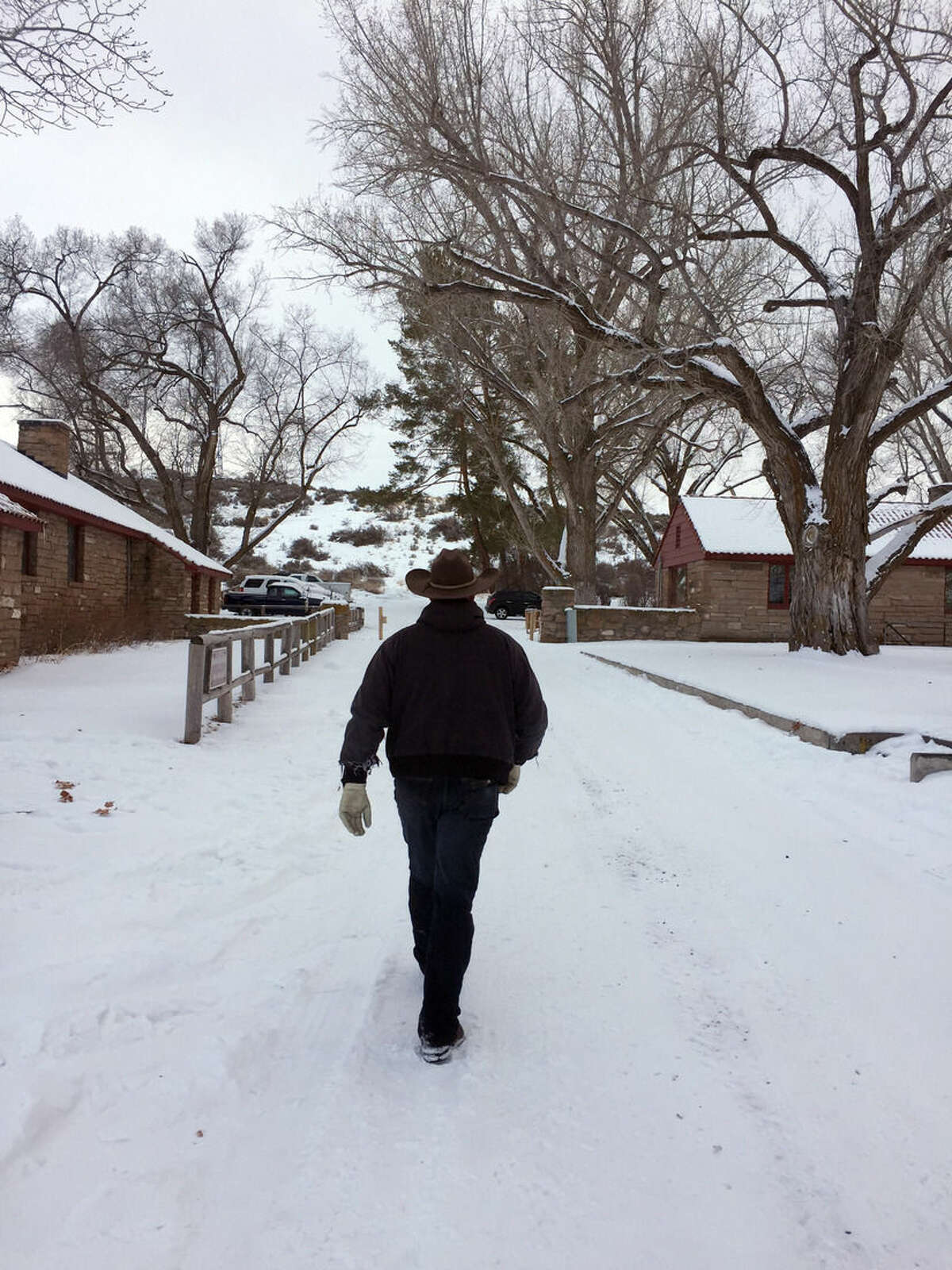 Ryan Bundy walks at the Malheur National Wildlife Refuge near Burns, Ore., Sunday, Jan. 3, 2016. Bundy is one of the protesters occupying the refuge to object to a prison sentence for local ranchers for burning federal land. (AP Photo/Rebecca Boone)