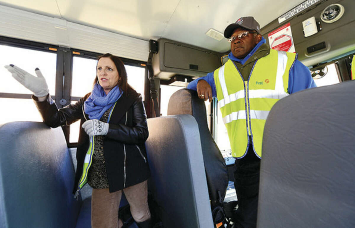 Hour photo / Erik Trautmann First Student location manager Theresa Taylor and driver Kevin Brown talk about the new school buses that will be put into service this week including the Thomas Built SAF-T-LINER® C2.