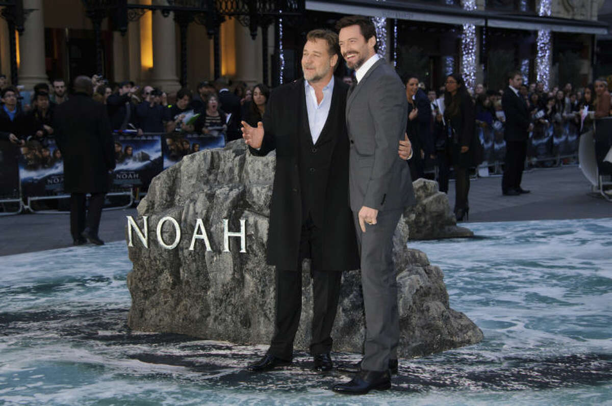 From left, New Zealand actor Russell Crowe and Australian actor Hugh Jackman arrive for the UK Premiere of Noah at a central London cinema, London, Monday, March 31, 2014. (Photo by Jonathan Short/Invision/AP)