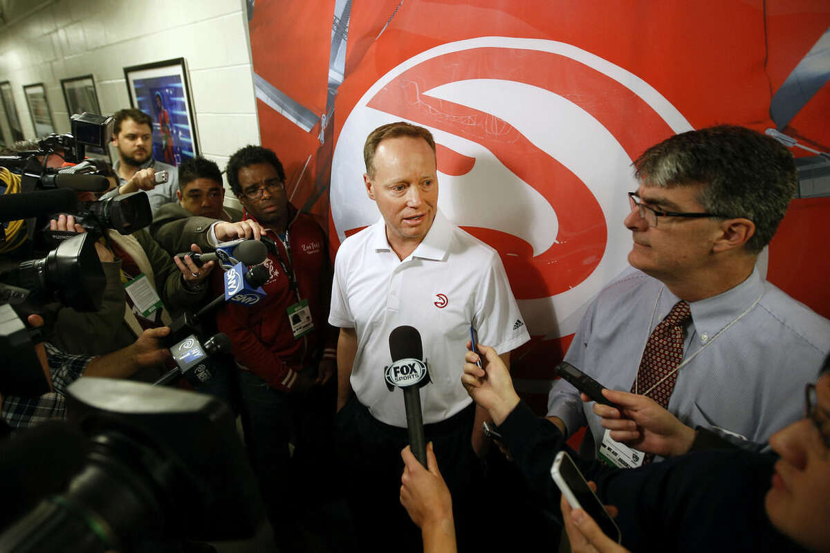 Atlanta Hawks coach Mike Budenholzer answers a question during his pre-game news conference before an NBA basketball game between the Atlanta Hawks and the Brooklyn Nets Wednesday, April 8, 2015, in New York. (AP Photo/Jason DeCrow)