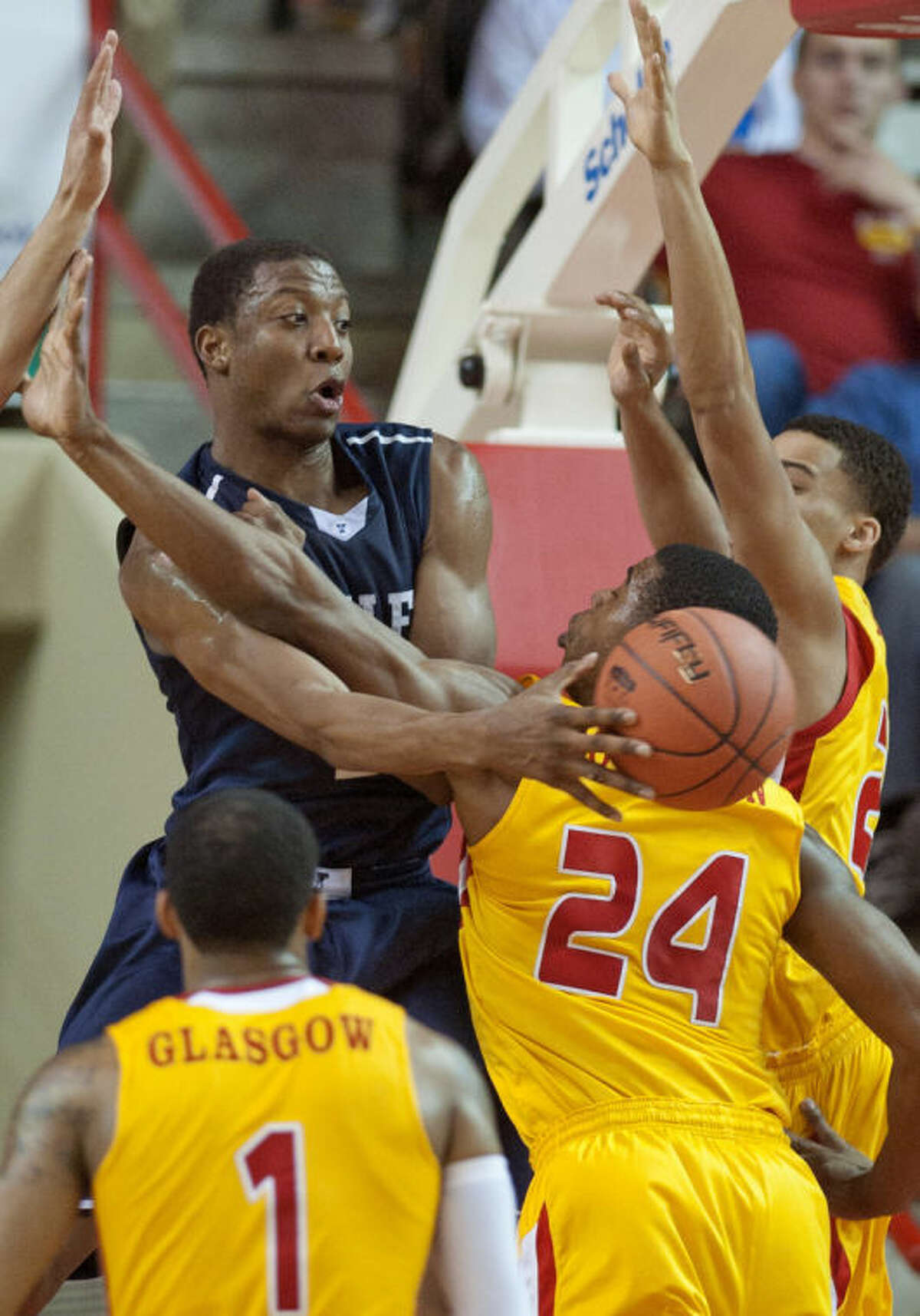 Virginia Military Institute's D.J. Covington (24) and Rodney Glasgow (1) battle for a rebound against Yale's Justin Sears (left) during the second half of an NCAA CIT semi-final college basketball game at Cameron Hall, Tuesday, April 1, 2014, in Lexington, Va. (AP Photo/Don Petersen)