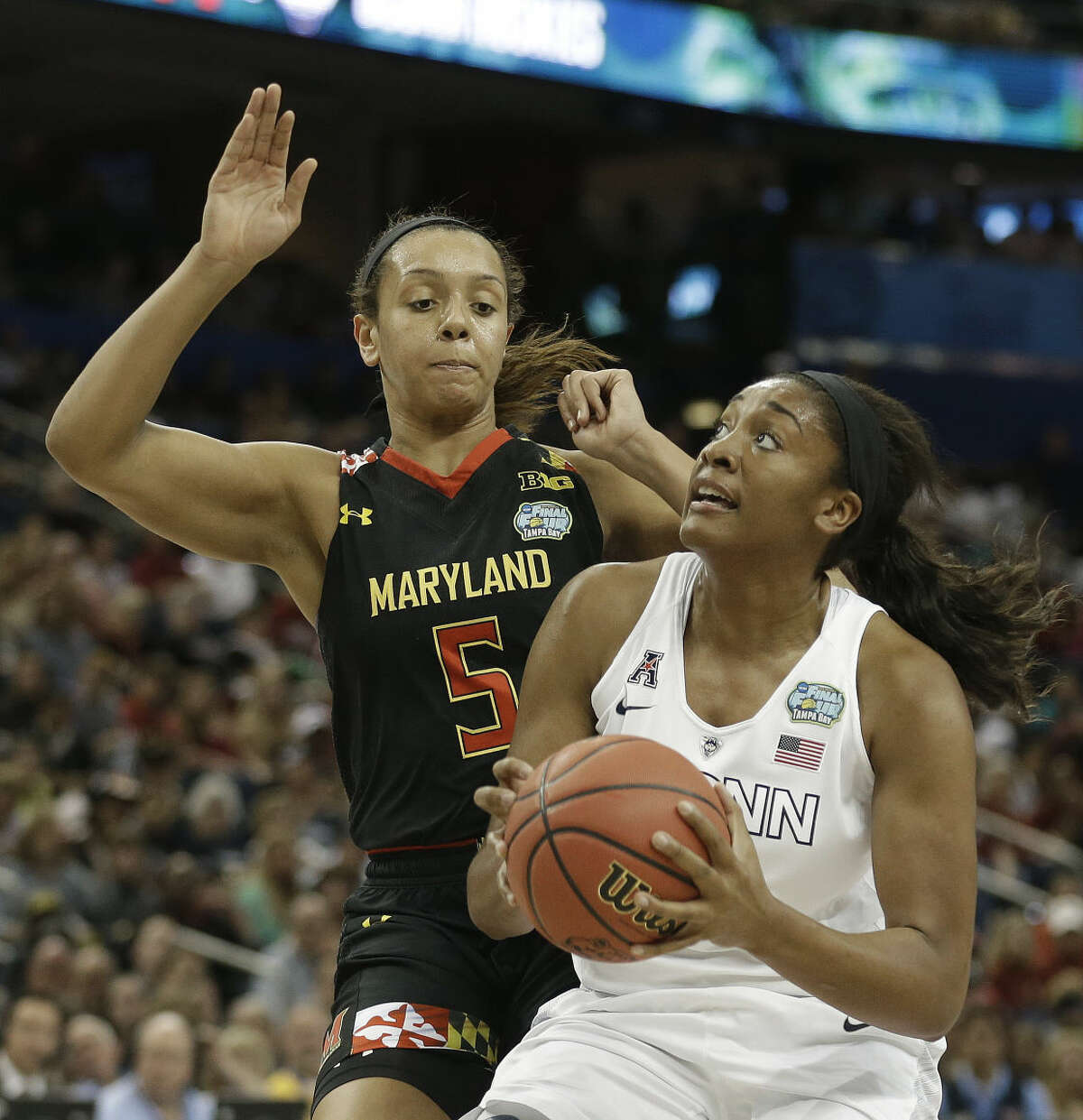 Connecticut forward Morgan Tuck (3) shoots against Maryland center Malina Howard (5) during the first half of the NCAA Women's Final Four tournament college basketball semifinal game, Sunday, April 5, 2015, in Tampa, Fla. (AP Photo/Brynn Anderson )