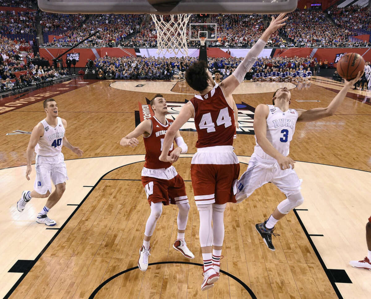 Wisconsin's Frank Kaminsky (44) tries to block a shot by Duke's Grayson Allen (3) during the first half of the NCAA Final Four college basketball tournament championship game Monday, April 6, 2015, in Indianapolis. (AP Photo/Chris Steppig, Pool)
