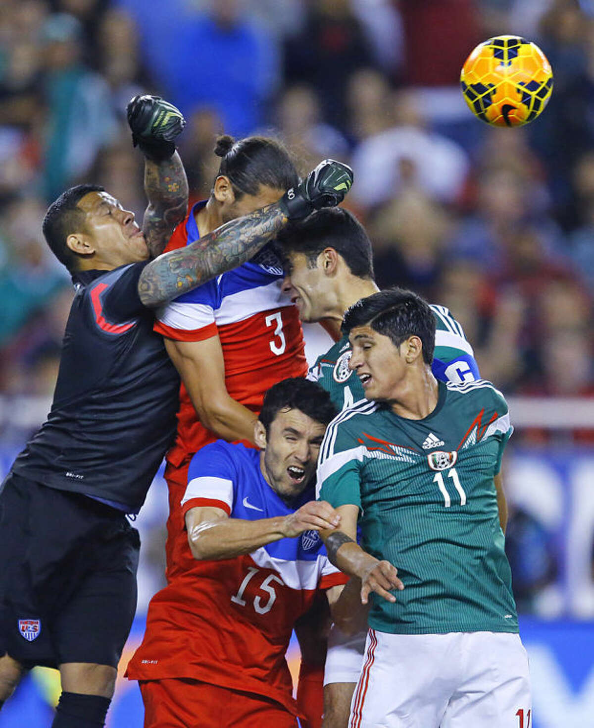 U.S. goalie Nick Rimando punches the ball to make a save against Mexico during an international friendly soccer match, Wednesday, April 2, 2014 in Glendale, Ariz. (AP Photo/The Arizona Republic, David Kadlubowski) MESA OUT MARICOPA COUNTY OUT MAGS OUT NO SALES