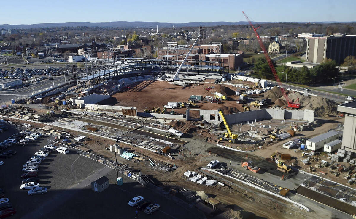 In this Nov. 17, 2015 photo, construction takes place on a new baseball stadium in the north end of Hartford, Conn., to be home for the Hartford Yard Goats, the Double-A affiliate of the Colorado Rockies. The project has been plagued by cost overruns and the theft of building materials. City officials said the planned $55 million, 9,000-seat ballpark will not be ready for opening day on April 7, 2016. (Stephen Dunn/The Hartford Courant via AP)