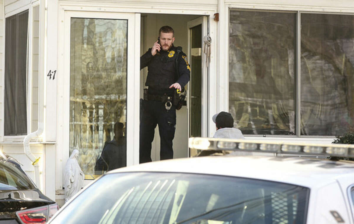 Hour photo / Erik Trautmann Norwalk police investigate an altercation at 41 Wilton Ave. Tuesday afternoon.