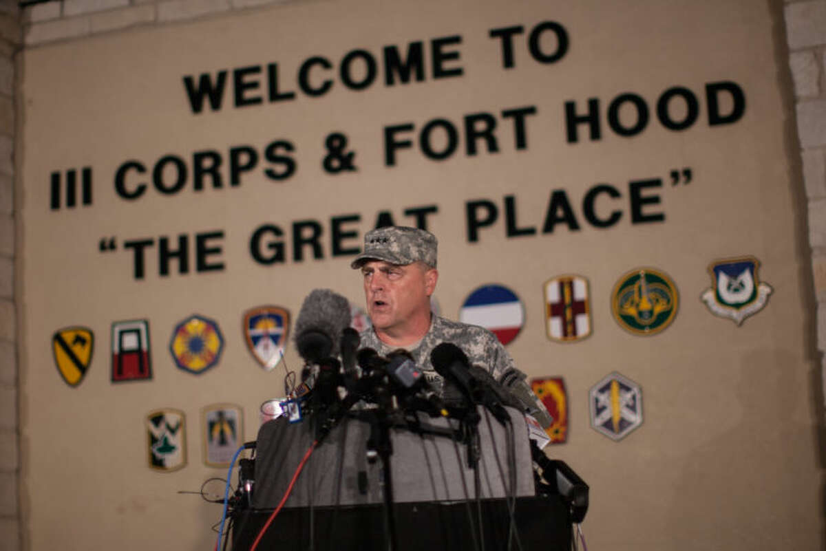 Lt. Gen. Mark Milley, commanding general of III Corps and Fort Hood, speaks with the media outside of an entrance to the Fort Hood military base following a shooting that occurred inside, Wednesday, April 2, 2014, in Fort Hood, Texas. Four people were killed, including the gunman, and 16 were wounded in the attack, authorities said. (AP Photo/Tamir Kalifa)