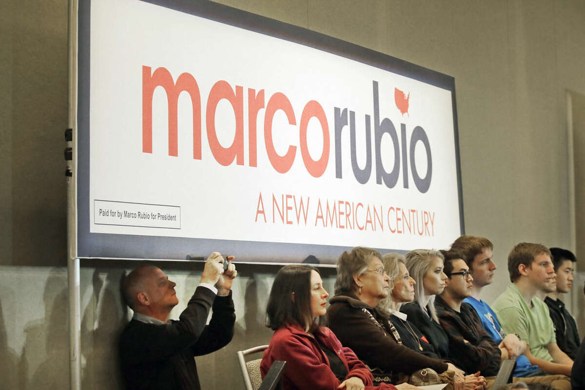 In this Jan. 6, 2016, photo, supporters of Republican presidential candidate Sen. Marco Rubio listen to him speak at a rally in Dallas. The expectations game for "establishment" candidates has added intrigue to the final sprint to Iowa's lead-off caucuses. While the fight for first place has settled into a two-way race between conservative favorites Ted Cruz and Donald Trump, some of the biggest unknowns surround the candidates for whom a loss in Iowa could still be viewed as a win. (AP Photo/LM Otero, File)