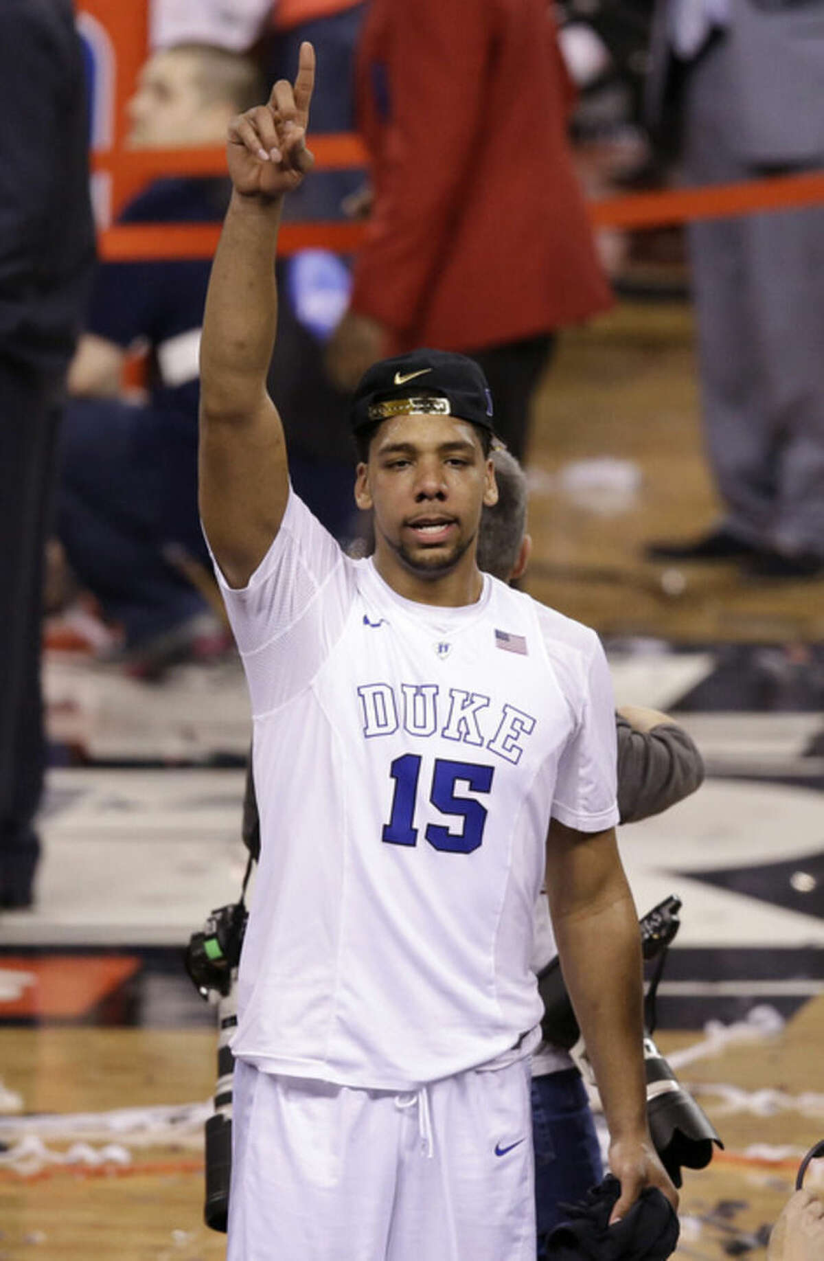 Duke's Jahlil Okafor celebrates after his team's 68-63 victory over Wisconsin in the NCAA Final Four college basketball tournament championship game Monday, April 6, 2015, in Indianapolis. (AP Photo/Darron Cummings)