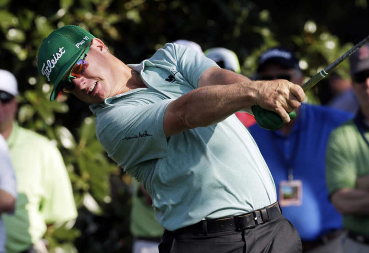Charley Hoffman tees off on the ninth hole during the first round of the Masters golf tournament Thursday, April 9, 2015, in Augusta, Ga. (AP Photo/Charlie Riedel)