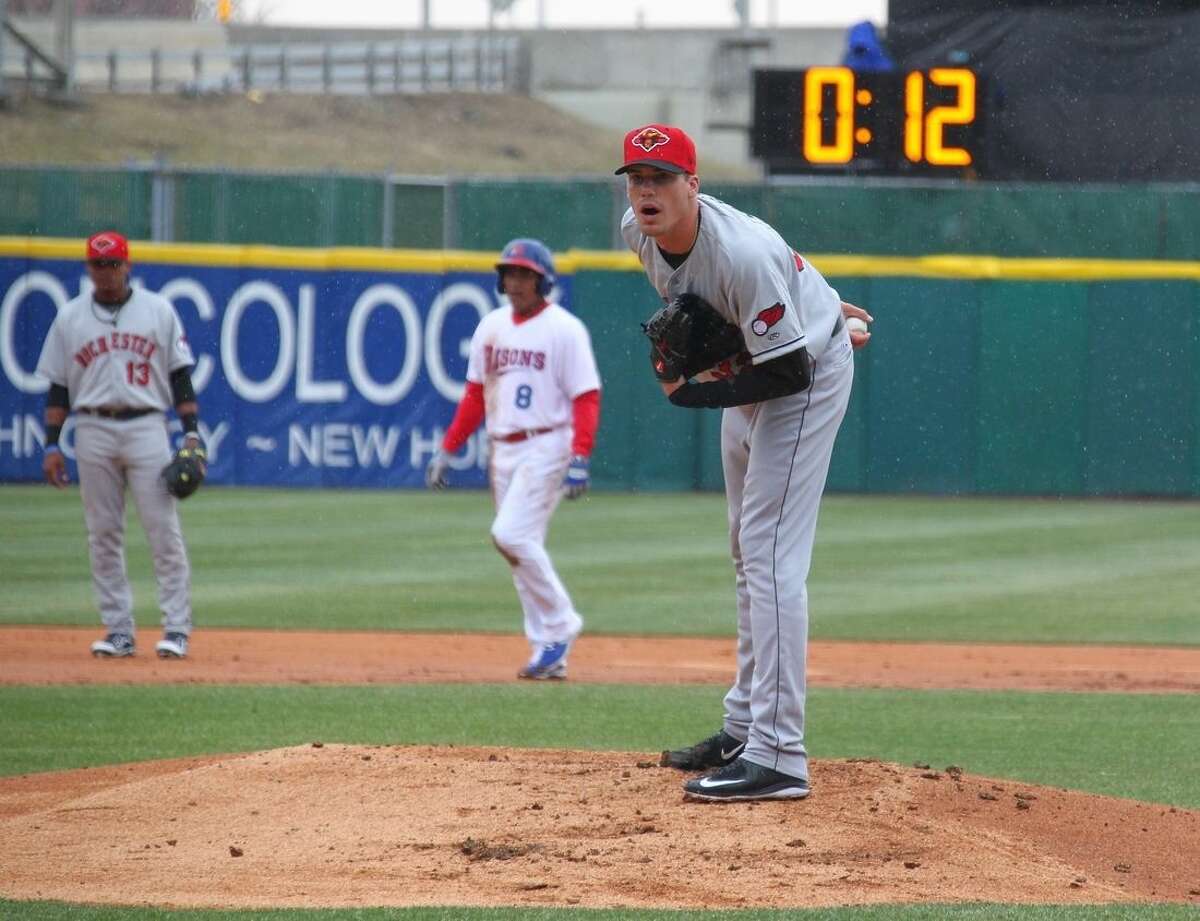Rochester Red Wings pitcher Alex Meyer (32) looks in for a signal as a 20-second pitch clock is used for the Triple-A baseball opener between the Buffalo Bisons and Red Wings in Buffalo, N.Y., Thursday, April 9, 2015. (AP Photo/Bill Wippert)