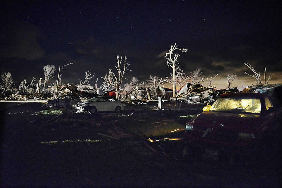 Damage after a tornado struck the small town of Fairdale Ill. the night of Thursday, April 9, 2015. Supercell thunderstorms produced a large tornado that touched down Thursday night in northern Illinois, killing at least one person and injuring at least seven others in one tiny community as severe weather pummeled the Midwest. Every home in the town was affected, authorities said. DeKalb County Sheriff Roger Scott said in a news release that approximately 15 to 20 were totally destroyed. (AP Photo/Daily Herald, John Starks)
