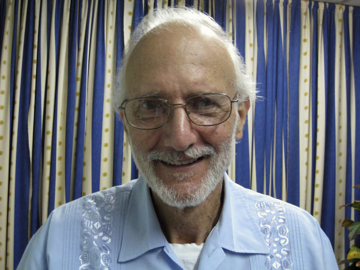 FILE - In this Nov. 27, 2012 file photo provided by James L. Berenthal, jailed American Alan Gross poses for a photo during a visit by Rabbi Elie Abadie and U.S. lawyer James L. Berenthal at Finlay military hospital as he serves a prison sentence in Havana, Cuba. The U.S. government masterminded the creation of a "Cuban Twitter" a communications network designed to undermine the communist government in Cuba, built with secret shell companies and financed through foreign banks, The Associated Press has learned. The project, dubbed "ZunZuneo," slang for a Cuban hummingbird?’s tweet, was publicly launched shortly after the 2009 arrest of Gross. He was imprisoned after traveling repeatedly to the country on a separate, clandestine USAID mission to expand Internet access using sensitive technology that only governments use. (AP Photo/James L. Berenthal, File)