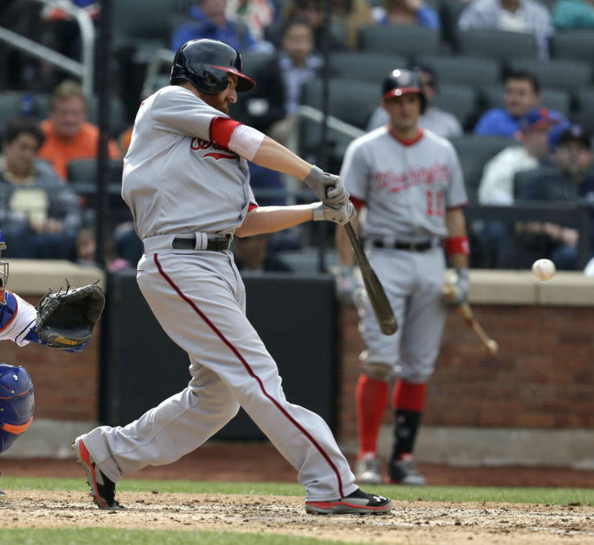 Washington Nationals' Adam LaRoche hits a two-run RBI single during the seventh inning of the baseball game against the New York Mets at Citi Field, Thursday, April 3, 2014 in New York. (AP Photo/Seth Wenig)