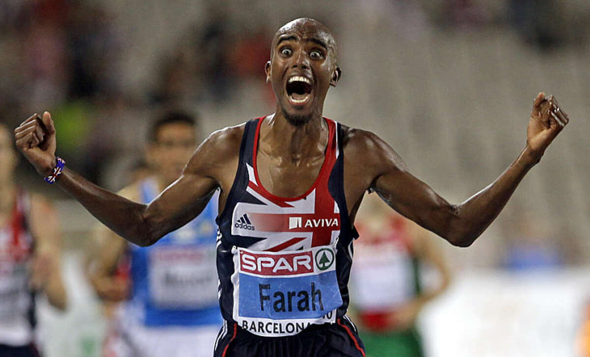 FILE - In this Tuesday, July 27, 2010 file photo, Britain's Mo Farah celebrates as he crosses the finish line to win the Men's 10000m event, during the European Athletics Championships, in Barcelona, Spain. Anja Niedringhaus, a courageous and immensely talented Associated Press photographer who has covered everything from sports to war, was killed while covering elections in Afghanistan on Friday April 4, 2014. Niedringhaus was in a car in eastern Afghanistan with AP reporter Kathy Gannon when, according to a freelancer who was with them, an Afghan policeman approached them, yelled "Allahu Akbar" - God is Great -and opened fire on them in the back seat with his AK-47. Niedringhaus was killed instantly and Gannon was wounded. (AP Photo/Anja Niedringhaus, File)