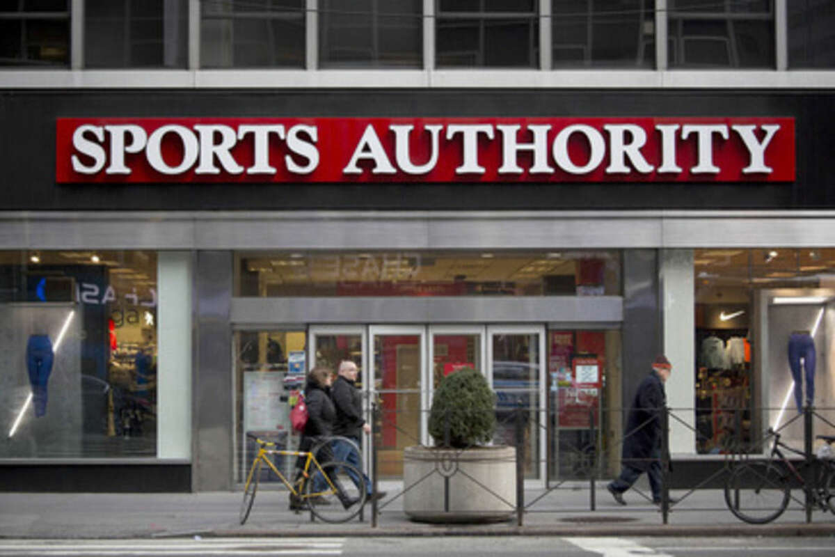 Pedestrians walk past a Sports Authority Inc. store in New York on Feb. 6. Sports Authority filed for bankruptcy Wednesday after failing to exploit the fitness boom that's been a rare bright spot in retail. MUST CREDIT: Bloomberg photo by John Taggart.