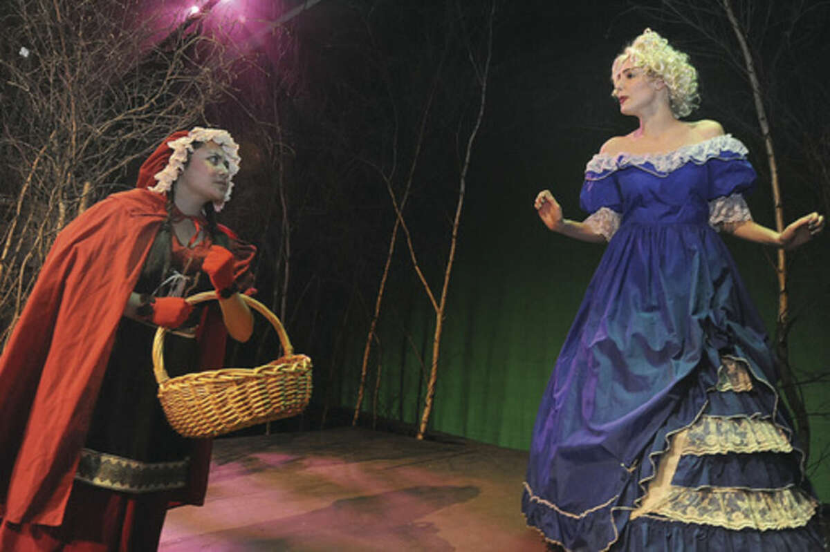 Hour photo/Matthew Vinci Sophie Starknan as Little Red Riding Hood and Amanda Mariano as Cinderella's stepmother perform in a dress rehearsal for Brien McMahon High School's play "Into the Woods."