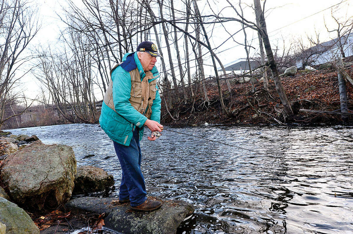 Hour photo / Erik Trautmann Local resident including Bill Geils fish for trout on the Norwalk River in Wilton on Opening Day Saturday.