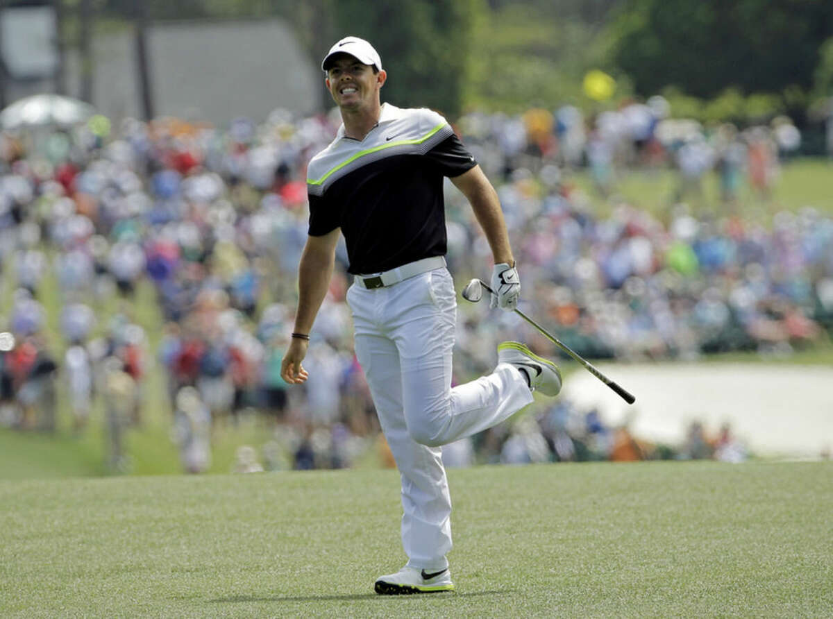 Rory McIlroy, of Northern Ireland, watches his shot after hitting on the first fairway during the third round of the Masters golf tournament Saturday, April 11, 2015, in Augusta, Ga. (AP Photo/David J. Phillip)