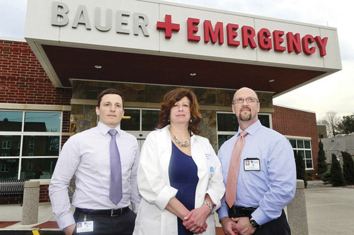Hour photo / Erik Trautmann Norwalk Hospital staff; Tom Mahoney, Emergency Operations Manager, Steve Papp, Director of Facility Operations, Lorraine Salavec, Patient Care Manager liason emergency operations with local police and fire departments.