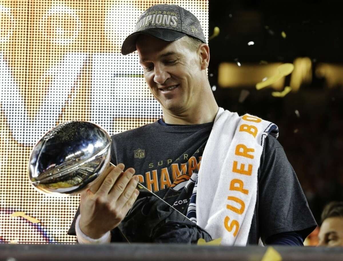 Denver Broncos’ Peyton Manning holds up the trophy after the NFL Super Bowl 50 football game Sunday, Feb. 7, 2016, in Santa Clara, Calif. The Broncos beat the Panthers 24-10. (AP Photo/David J. Phillip)