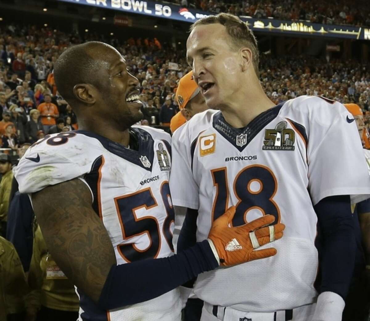 Denver Broncos’ Von Miller (58) and Peyton Manning (18) celebrate after the NFL Super Bowl 50 football game Sunday, Feb. 7, 2016, in Santa Clara, Calif. The Broncos beat the Panthers 24-10. (AP Photo/David J. Phillip)