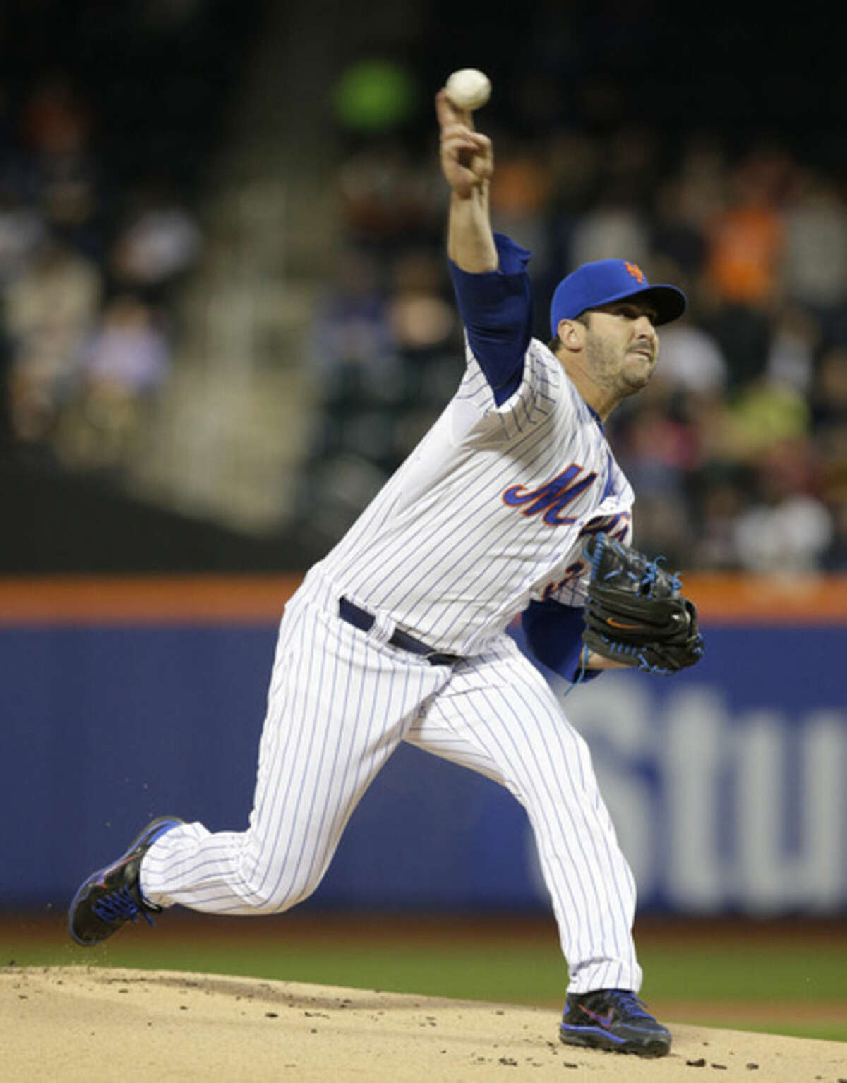 New York Mets starting pitcher Matt Harvey delivers in the first inning of a baseball game against the Philadelphia Phillies in New York, Tuesday, April 14, 2015. (AP Photo/Kathy Willens)
